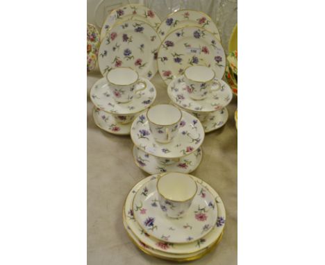 A Drapers Company part tea service retailed by Alfred B. Pearce 39 Ludgate Hill, London decorated with flowering cornflowers,
