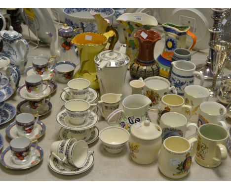 Ceramics - commemorative beakers; Poole cream jug; a Burleigh ware jug; a Shelley jug; a Noritake egg shell tea service