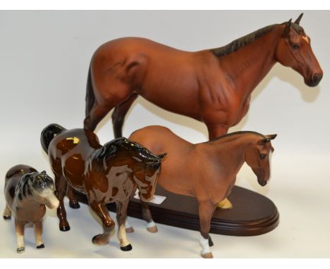 A John Beswick Nijinsky model on a wooden plinth, boxed; a Royal Doulton model of a bay Horse, raised foreleg; a Melba type m