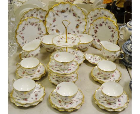 A Royal Crown Derby Royal Antoinette pattern tea service comprising seven tea cups & saucers, sugar bowls, milk jugs, cake st