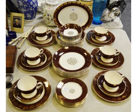 A Midwinter Stylecraft Classic shape part dinner and tea service, maroon border.