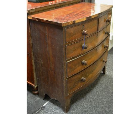 A George III mahogany bow fronted chest of two short above three long cock beaded drawers, turned wooden handles, bracket fee