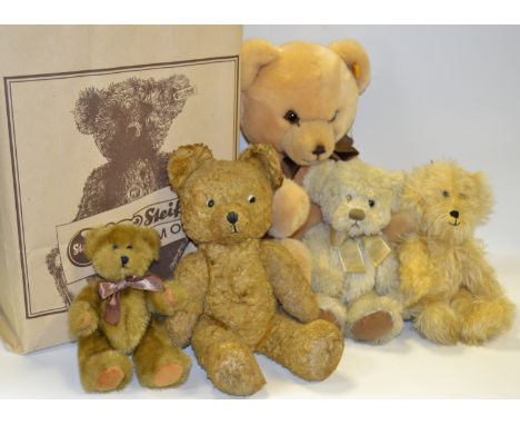 A Steiff Petsy teddy bear, dark blond, jointed, woven fur, original tags, box and bag; a mohair fur blond jointed bear with o