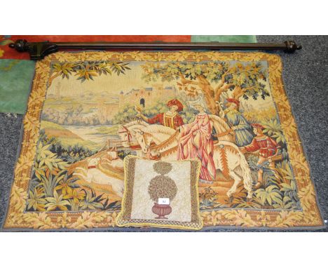 A French wall hanging tapestry depicting a Tudor scene of a Falconer and his maiden riding horses; hounds at their feet, bord