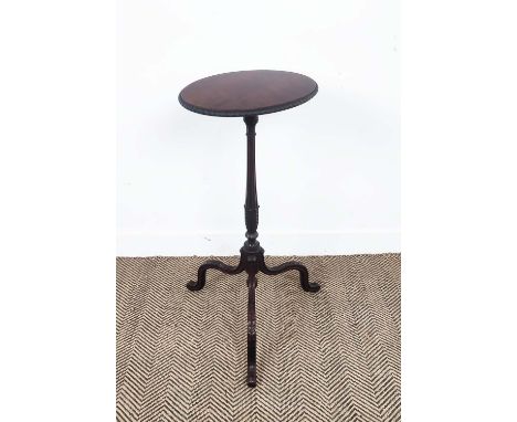 CANDLE STAND, circa 1900, mahogany, an oval top with carved detail to edge, on a reeded column with carved tripod base, 42cm 