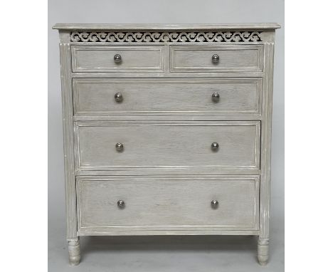 COMMODE, French style traditionally grey painted with two short and three long drawers with pierced frieze and turned support