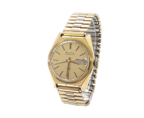 Bulova Accuquartz gold plated gentleman's wristwatch, the gilt dial with day/date aperture, sweep centre seconds and baton ma
