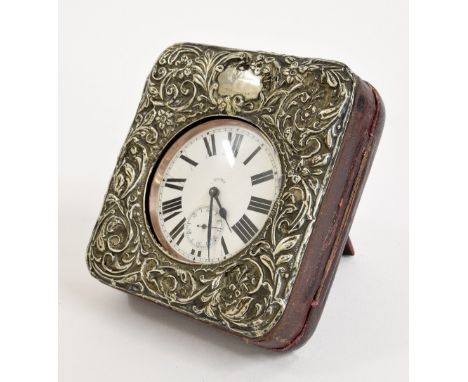 Nickel cased eight day Goliath pocket watch with subsidiary seconds dial, within an outer leather and foliate silver embossed
