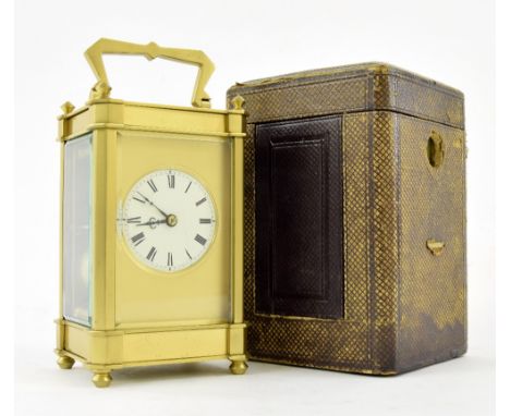 Carriage clock striking on a gong, the 1.75" cream dial within a gilt mask and pillared case, 6.25" high, also with a Morocco