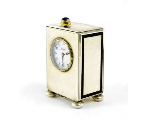 Tiffany & Co miniature white metal clock timepiece, stamped twice on the removable case back and signed on the dial, upon fou