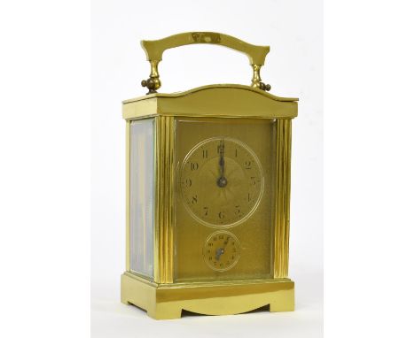 Attractive brass carriage clock timepiece with alarm, within a pillared rounded arched case, 6" high