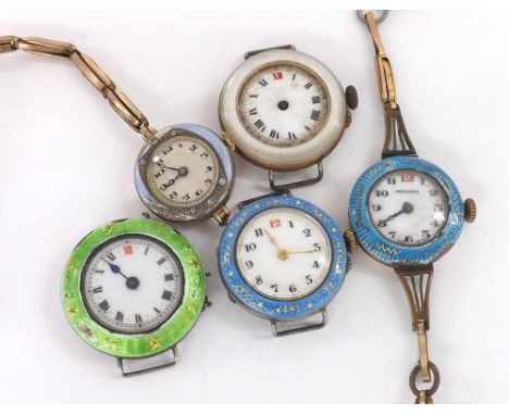 Two silver cylinder and enamel wire-lug wristwatch heads; together with two gold plated cylinder and enamel wire-lug wristwat