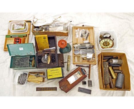 Quantity of various clock tools and parts including staking sets, clock hands, various clock weights etc