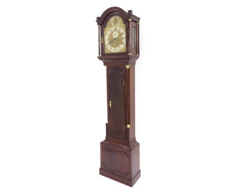 Mahogany eight day longcase clock with five pillar movement, the 12" brass arched dial with silvered chapter ring enclosing a