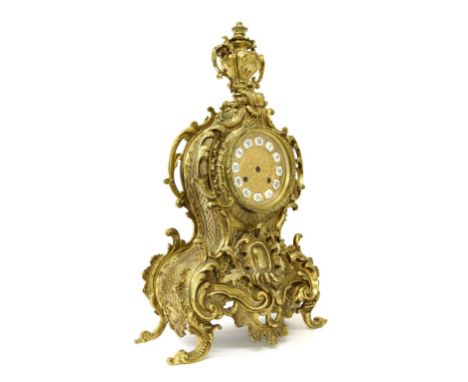 Good ornate gilt metal balloon shaped case, the 4.5" gilt engraved dial with Roman cartouche enamel numerals, surmounted by a