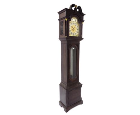 Mahogany three train longcase clock playing on five tubular bells, the 12" brass dial with silver chapter ring enclosing a ma