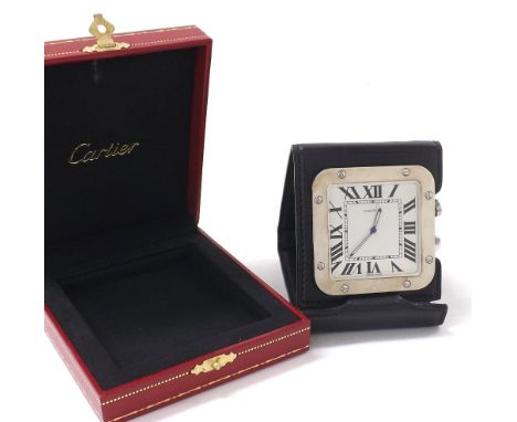 Cartier stainless steel travel alarm clock with leather travel case, ref. 2750, no. 008208, within a Cartier red leather box 