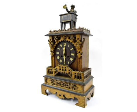 Rare oak, pine and ebonised Black Forest automata magician two train mantel clock, the 6.5" dial within an architectural step