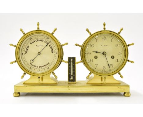 Ormolu marine inspired desk compendium, comprising twin bulkhead ship's wheel cased two train clock and barometer dials signe