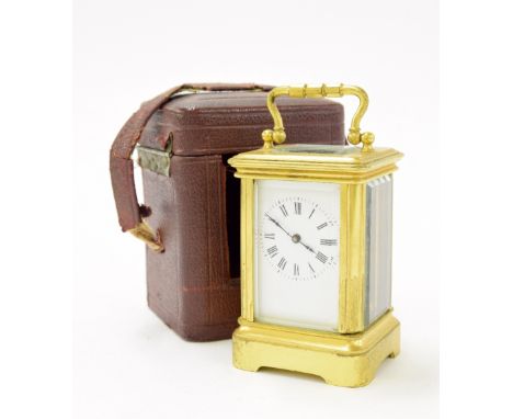 Miniature carriage clock timepiece within a corniche gilded brass case, 4" high; also with Morocco leather travelling case