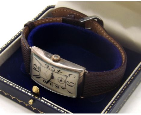 Goldsmiths & Silversmiths silver curved rectangular gentleman's wristwatch, import hallmarks London 1929, case no. 2771020, s