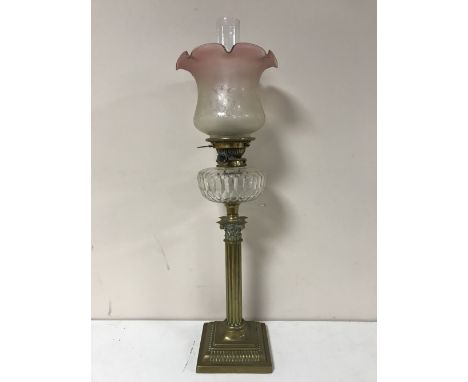 A Victorian glass oil lamp with clear glass reservoir