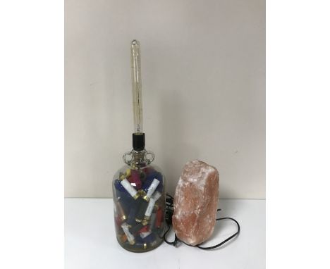 A Saltrock lamp together with a demijohn lamp containing shotgun shells