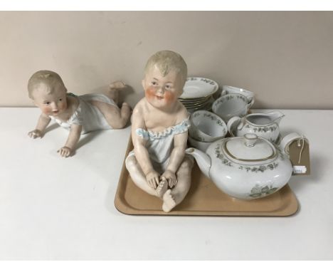 Two continental bisque figures of babies together with a Bavarian tea service  CONDITION REPORT: Crawling baby missing right 