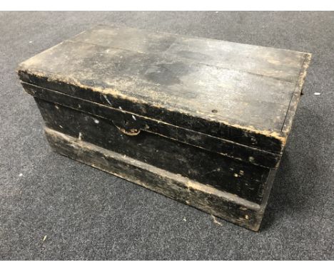 An antique pine joiner's toolbox containing assorted hand tools