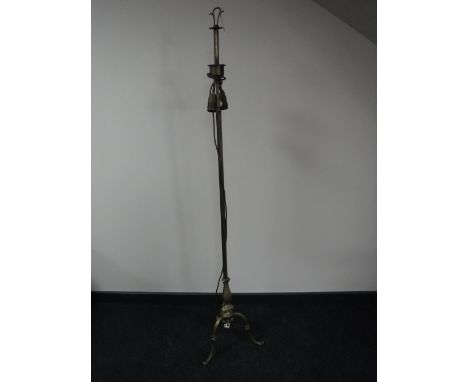 A brass adjustable standard lamp