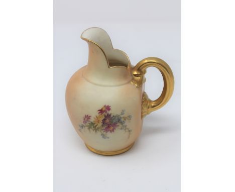 A Royal Worcester blush ivory gilded jug, height 14cm. 