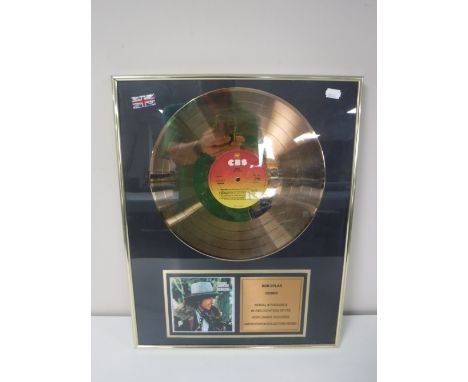 A brass framed gold disk Bob Dylan Desire