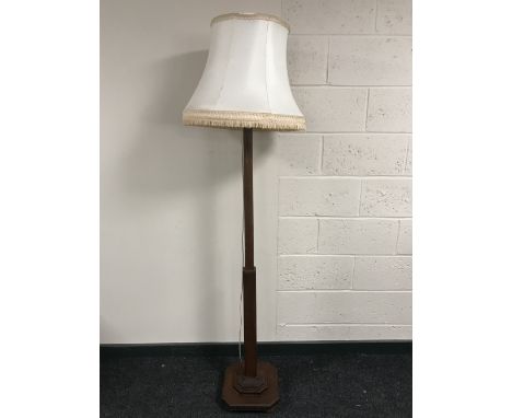 An oak standard lamp with shade
