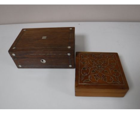 A Victorian rosewood and mother of pearl inlaid jewellery box, together with an Eastern inlaid wood trinket box. (2) 