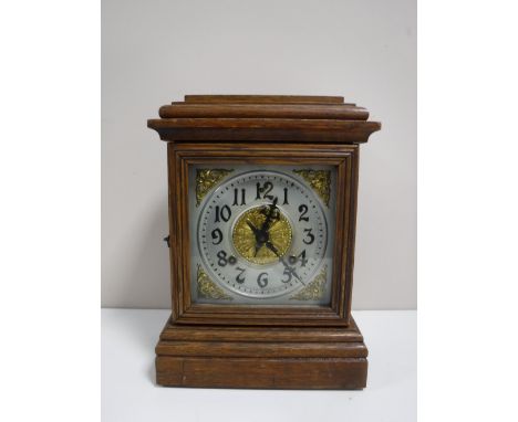 An oak cased American Ansonia mantel clock