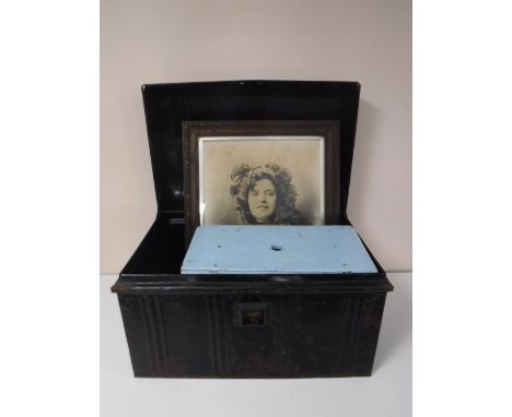 A tin trunk together with a painted cracket, brass framed mirror, Edwardian oak framed black and white photograph