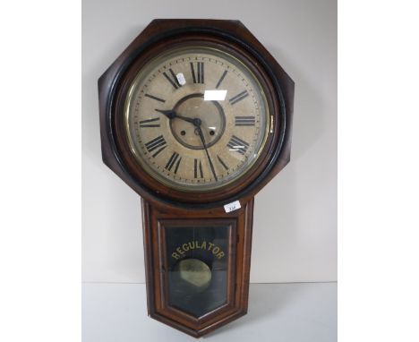 An antique mahogany regulator wall clock
