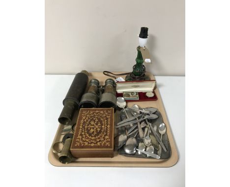 A tray containing antique glass oil lamp, assorted cutlery, pair of field glasses, brass leather bound telescope parts, Rotar