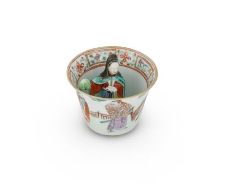 A Chinese Famille Rose figural 'trick' cup, Daoguang mark and period, the exterior painted with a scholar and attendant speak