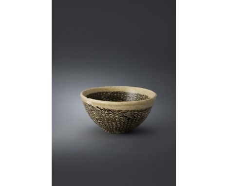 A Chinese Cizhou pottery marbled bowl, Northern Song-Jin dynasty, 11th-13th century, the unglazed foot showing the twisting o