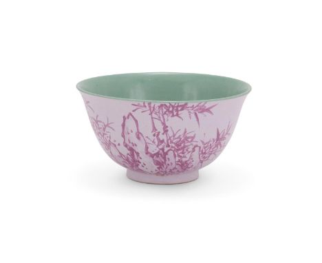 A Chinese Yixing enamelled bowl, Qing Dynasty, with deep rounded sides flaring at the rim, the exterior painted on one side w