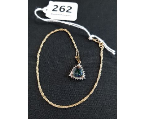 9CT GOLD MOUNTED MYSTIC TOPAZ AND DIAMOND PENDANT ON 9CT GOLD CHAIN