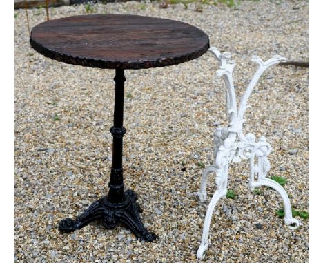 A traditional circular wooden top table to/with a Victorian style cast iron tripod table base, both a/f (2) 