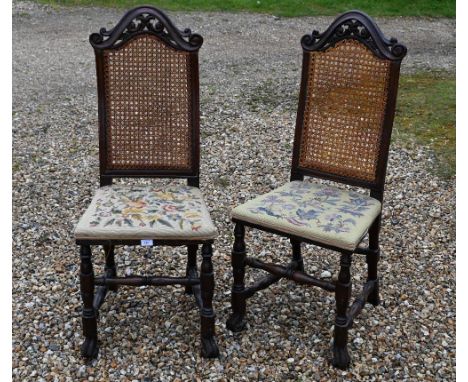 A pair of antique cane backed side chairs with floral tapestry seats (2) 