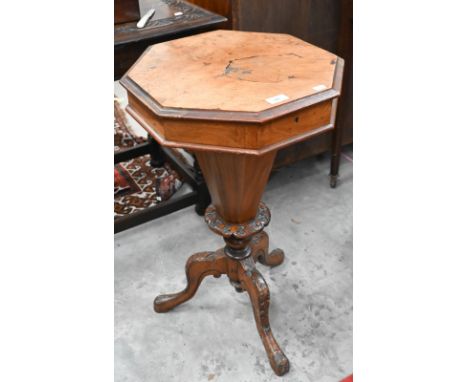 A Victorian octagonal walnut sewing table with carved tripod base, 42 cm diam x 70 cm high 