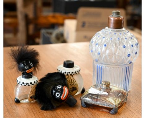 A vintage French pressed glass scent bottle with blue enamelled decoration, by J Viard, 11 cm high to/w two Vigny 'Golly -' s