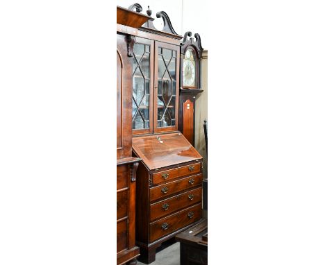 A 19th century mahogany inlaid bureau bookcase with astragal glazed doors over fall-front panel with fitted interior and four