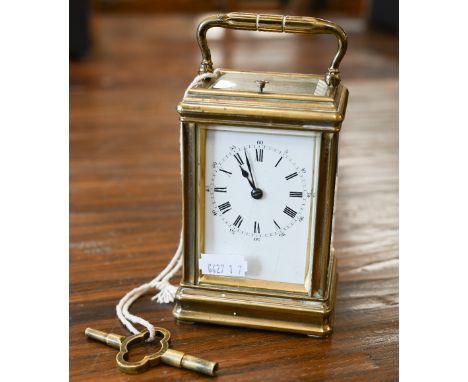 A carriage clock repeat striking on a coiled gong, 15 cm overall 