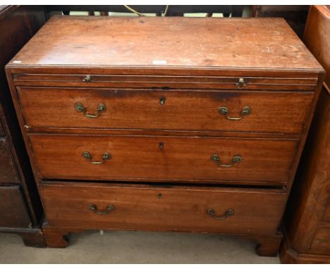 A George III mahogany chest of three long graduating drawers below brush slide, raised on shaped bracket feet, 92 x 48 x 82 c