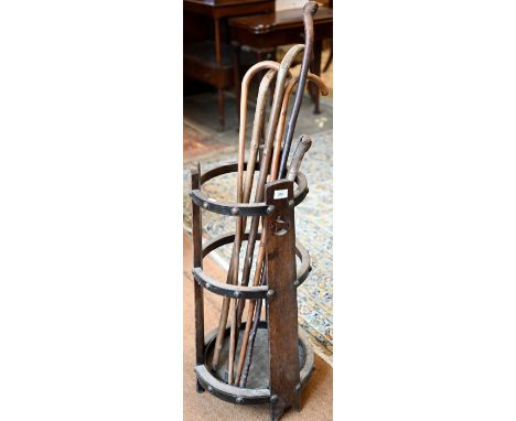 An Arts &amp; Crafts circular tapering open stick stand to/with sticks, 30 cm dia. x 73 cm h 